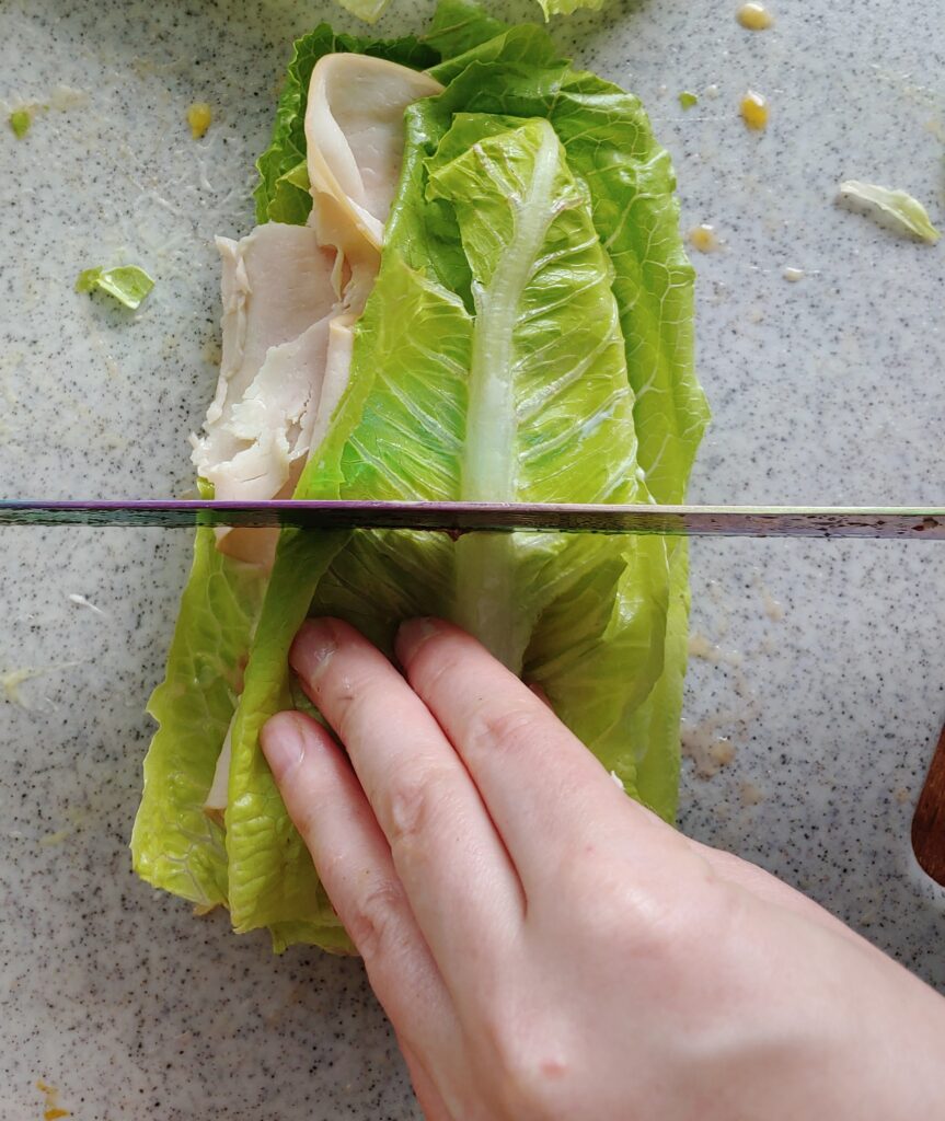 cut lettuce wrap sandwich in half