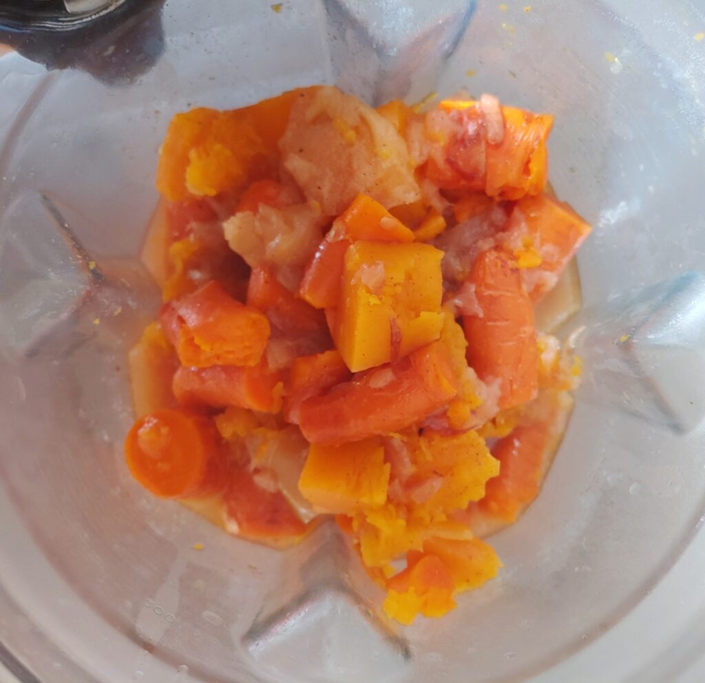 apples, carrots and butterut squash in blender