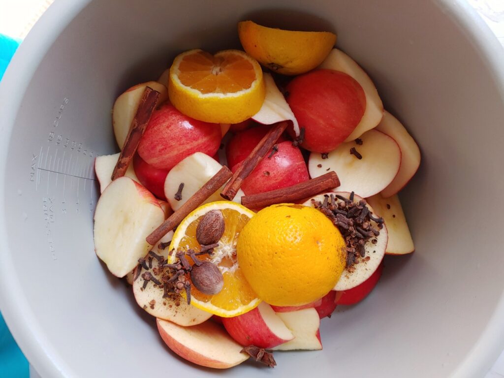 apples, oranges, and whole spices in instant pot or ninja foodi pot