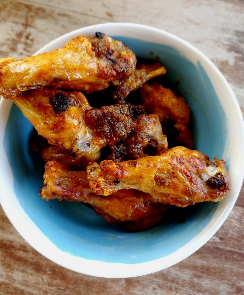 air fried curry chicken wings in bowl