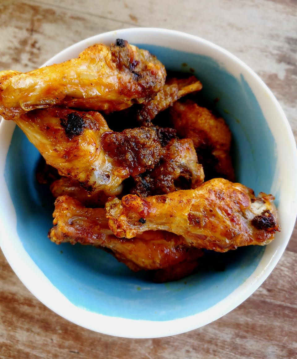 air fried curry chicken wings in bowl